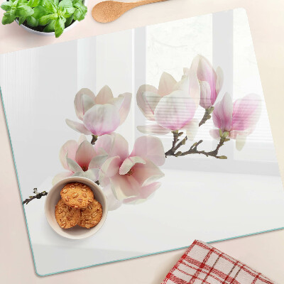 Glas skærebræt Magnoliablomster på en gren