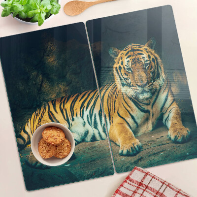 Skærebræt i glas Tiger liggende på klipperne