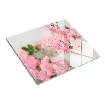 Skærebræt i glas Lyserøde blomster i en vase