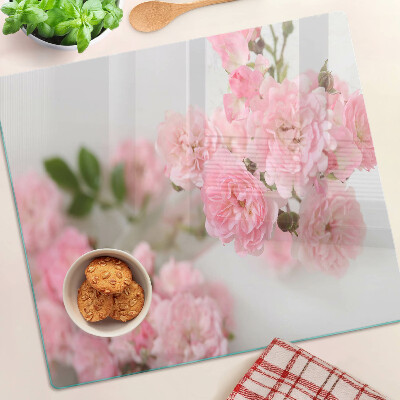 Skærebræt i glas Lyserøde blomster i en vase