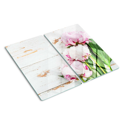 Skærebræt i glas Pæonblomster på en træbaggrund