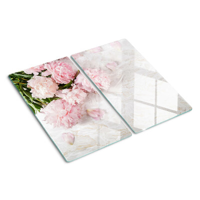 Skærebræt i glas Pæonblomster på en marmorbaggrund