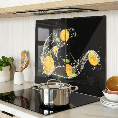 Skærebræt i glas Citrusfrugter i vand