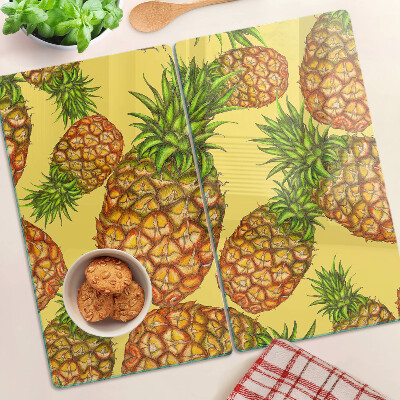 Skærebræt i glas Ananas på en gul baggrund