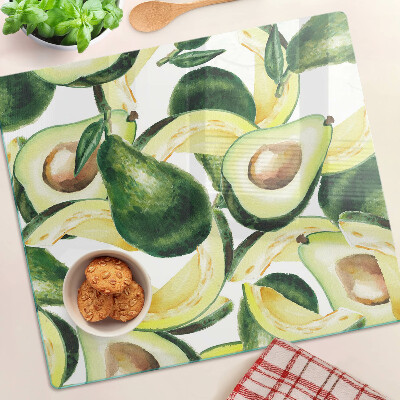 Skærebræt i glas Avocado på en baggrund af blade