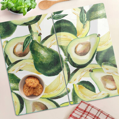 Skærebræt i glas Avocado på en baggrund af blade
