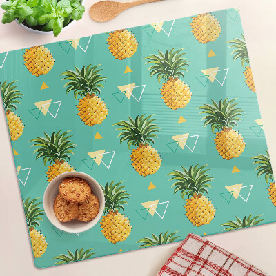Glas skærebræt Ananas på en turkis baggrund