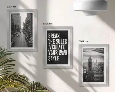 Billedvæg med byens gader i sort-hvid og inspirerende citat