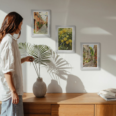 Billedvæg Charmerende gader med blomster og citroner i baggrunden