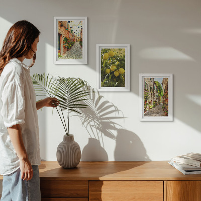 Billedvæg Charmerende gader med blomster og citroner i baggrunden