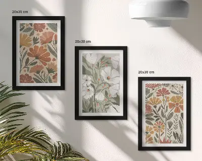 Billeder og rammer med blomstermønstre i orange og grønne nuancer