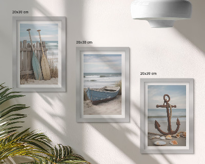 Moderne billedsæt En strand med en robåd og et anker i sandet