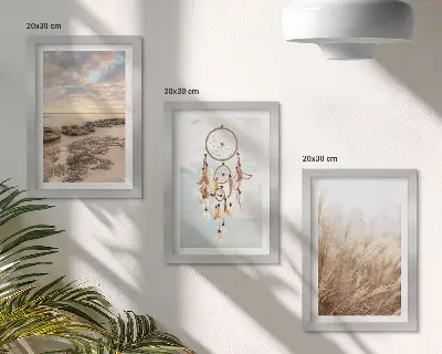 Billedvæg med motiv af havudsigt med skyer, drømmefanger og græs