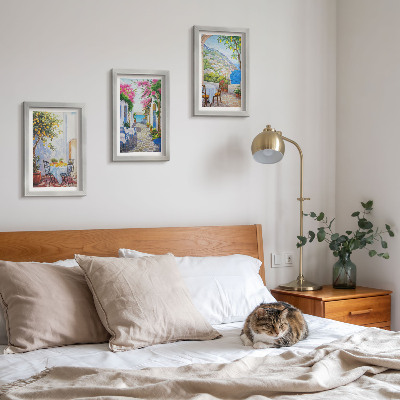 Pakke med billeder og rammer Charmerende gader med blomstrende planter og havudsigt