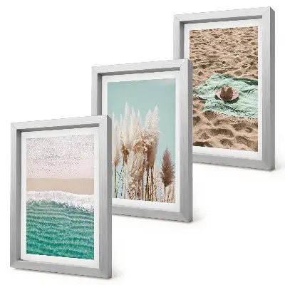 Billedvæg med motiv af strand, bølger, græs, hat, sand og afslappende natur