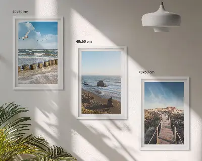 Billedvæg med motiv af strand bølger himmel og mole