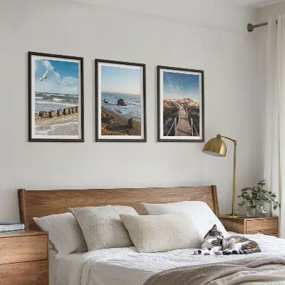 Billedvæg med motiv af strand bølger himmel og mole