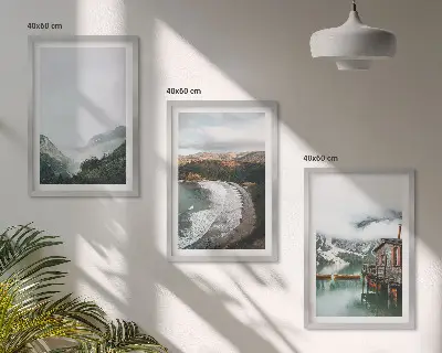 Billedvæg inspiration med motiver af bjerge, strand, skyer og vand