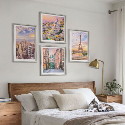Billedvæg over sofa New York Paris Oia Warszawa tusmørke