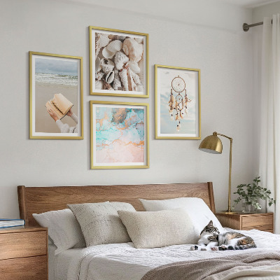 Billedvæg over sofa Muslingeskaller boho bog