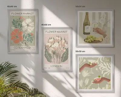 Blomsterplakat med vinby-motiv til væggen over sofaen