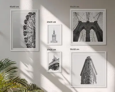 Billedsæt over sofa med motiv af sort og hvid storbyarkitektur