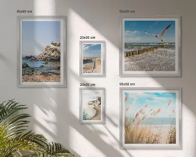 Billedsæt over sofa med strandlandskaber ved havet